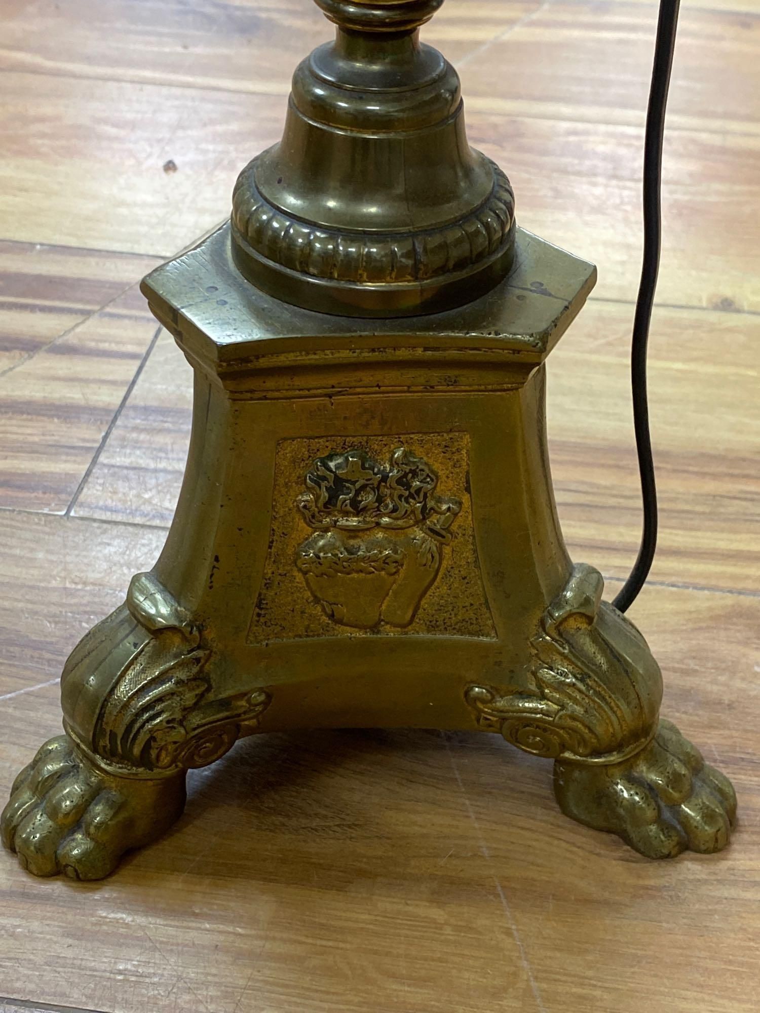 A brass column lamp and a brass standard lamp on three paw feet (with shades)